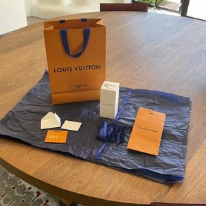 Louis Vuitton gift bag, tissue paper, lots of ribbons